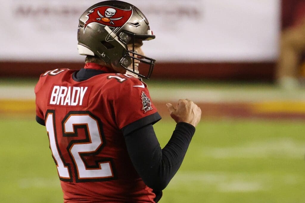 Jan 9, 2021; Landover, Maryland, USA; Tampa Bay Buccaneers quarterback Tom Brady (12) celebrates in the final two minutes against the Washington Football Team in the fourth quarter at FedExField.