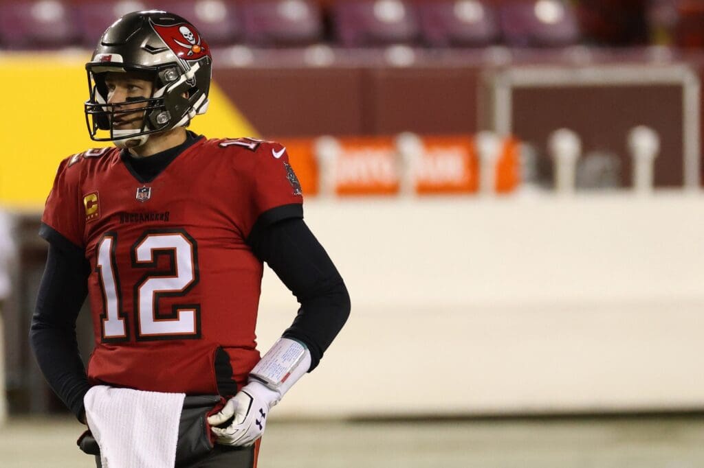 Jan 9, 2021; Landover, Maryland, USA; Tampa Bay Buccaneers quarterback Tom Brady (12) stands on the field during warmups warmups prior to the Buccaneers' game against the Washington Football Team at FedExField.