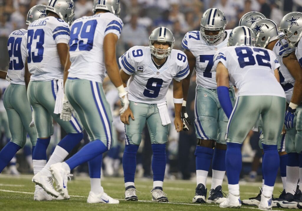 Sep 28, 2014; Arlington, TX, USA; Dallas Cowboys quarterback Tony Romo (9) calls the play in the huddle against the New Orleans Saints at AT&T Stadium. Mandatory Credit: Matthew Emmons-USA TODAY Sports