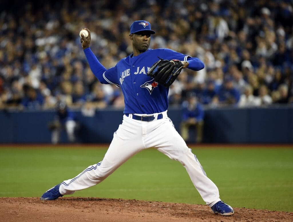 Oct 20, 2015; Toronto, Ontario, CAN; Toronto Blue Jays relief pitcher LaTroy Hawkins (32) throws during the seventh inning against the Kansas City Royals in game four of the ALCS at Rogers Centre.