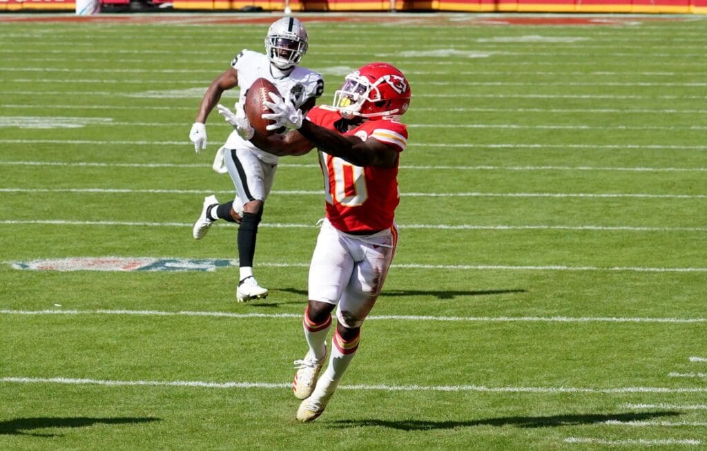 Oct 11, 2020; Kansas City, Missouri, USA; Kansas City Chiefs wide receiver Tyreek Hill (10) catches a pass during the first half against the Las Vegas Raiders at Arrowhead Stadium.
