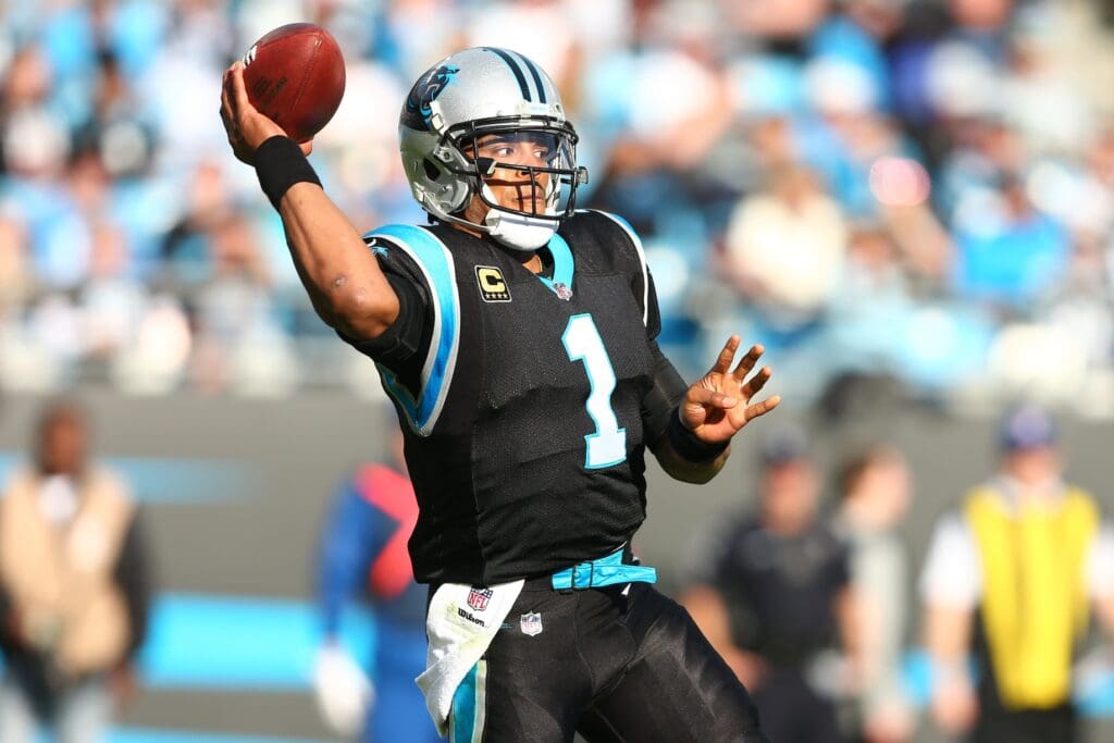 Nov 25, 2018; Charlotte, NC, USA; Carolina Panthers quarterback Cam Newton (1) passes the ball in the third quarter against the Seattle Seahawks at Bank of America Stadium.
