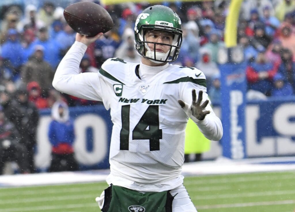 Dec 29, 2019; Orchard Park, New York, USA; New York Jets quarterback Sam Darnold (14) throws a pass against the Buffalo Bills in the second quarter at New Era Field.