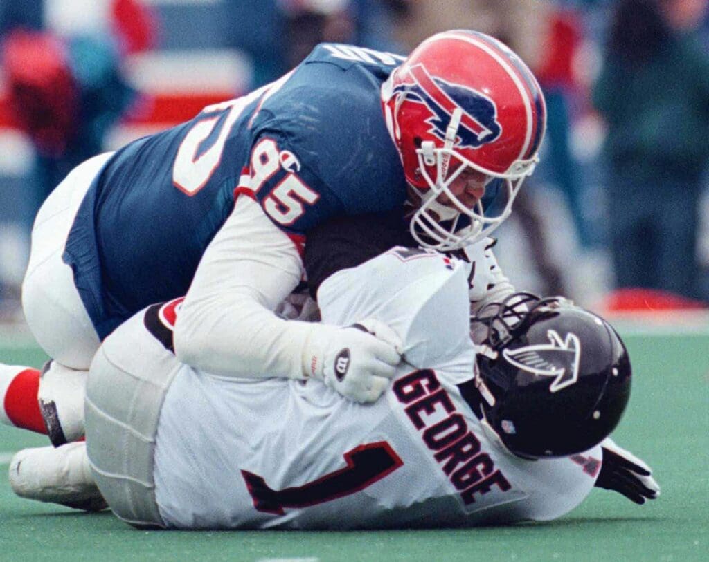 Bryce Paup sacks Jeff George in the second quarter of a game on Nov. 12. 1995. Bills Vs Falcons