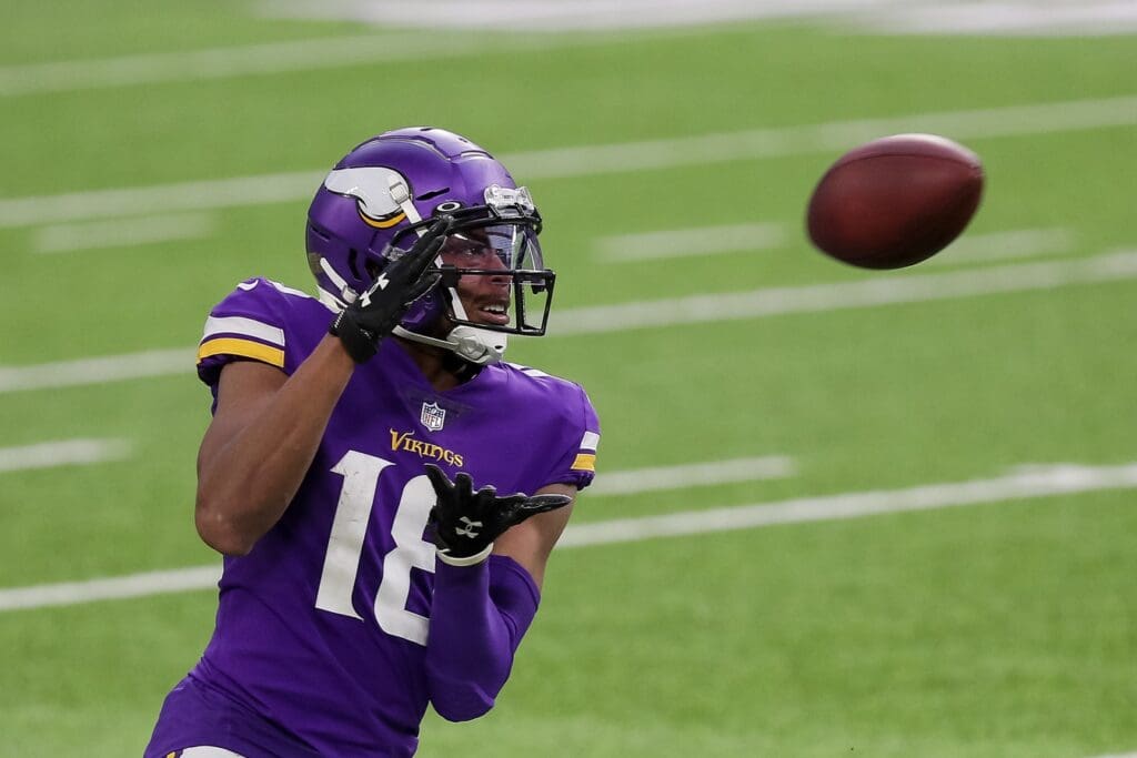 Dec 20, 2020; Minneapolis, Minnesota, USA; Minnesota Vikings wide receiver Justin Jefferson (18) catches a pass in the third quarter against the Chicago Bears at U.S. Bank Stadium