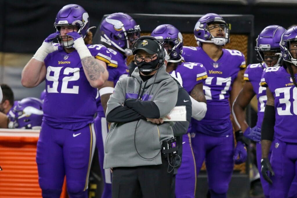 Dec 25, 2020; New Orleans, Louisiana, USA; Minnesota Vikings head coach Mike Zimmer watches the game in the second quarter against the New Orleans Saints at the Mercedes-Benz Superdome.