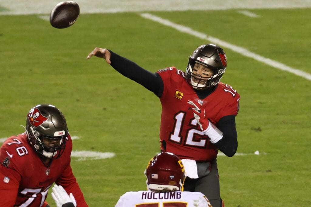 Jan 9, 2021; Landover, Maryland, USA; Tampa Bay Buccaneers quarterback Tom Brady (12) passes the ball against the Washington Football Team at FedExField.