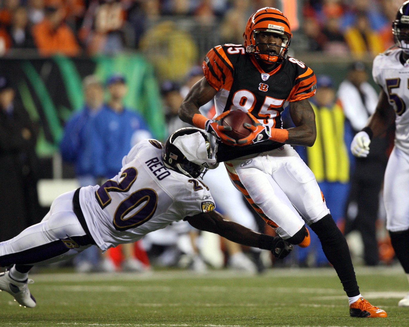 Nov 30, 2006; Cincinnati, OH, USA; Cincinnati Bengals receiver (85) Chad Johnson runs after a catch against Baltimore Ravens safety (20) Ed Reed in the first quarter at Paul Brown Stadium. Mandatory Credit: Matthew Emmons-USA TODAY Sports © copyright Matthew Emmons