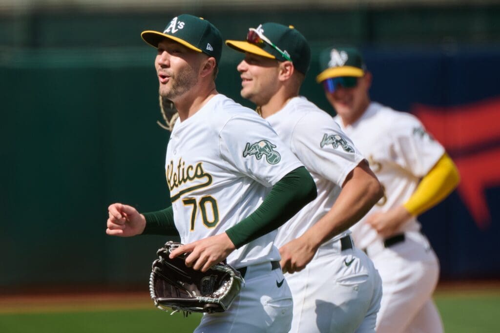 Apr 14, 2024; Oakland, California, USA; Oakland Athletics pitcher Lucas Erceg (70) reacts after making a defensive play for an out against the Washington Nationals during the seventh inning at Oakland-Alameda County Coliseum