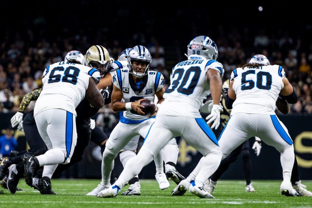 Sep 8, 2024; New Orleans, Louisiana, USA; Carolina Panthers quarterback Bryce Young (9) hands off to running back Chuba Hubbard (30) during the first half at Caesars Superdome.