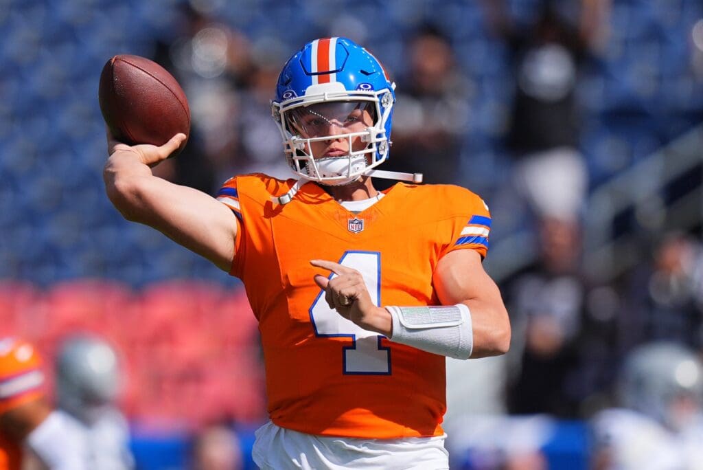 Oct 6, 2024; Denver, Colorado, USA; Denver Broncos quarterback Zach Wilson (4) warms up before the game against the Las Vegas Raiders at Empower Field at Mile High
