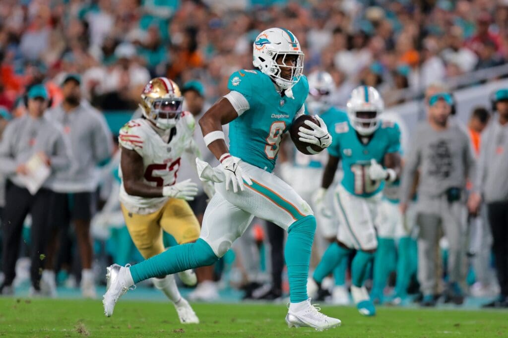 Dec 22, 2024; Miami Gardens, Florida, USA; Miami Dolphins tight end Jonnu Smith (9) runs with the football against the San Francisco 49ers during the third quarter at Hard Rock Stadium.