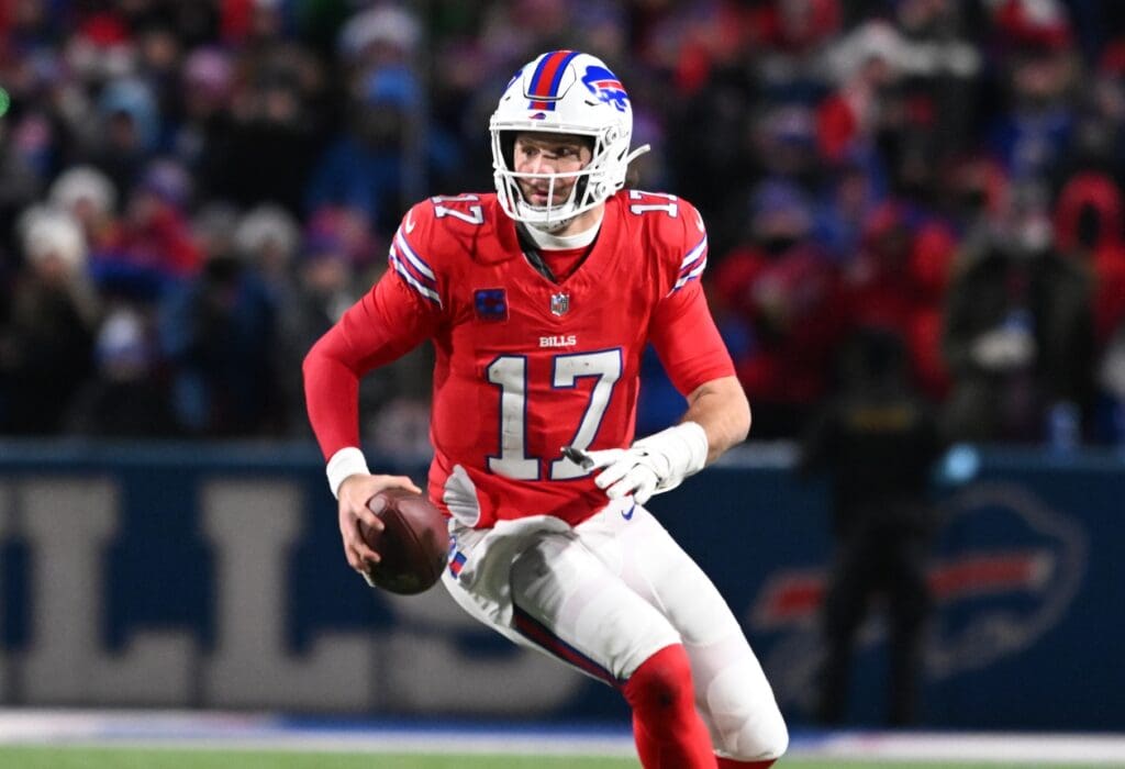 Dec 22, 2024; Orchard Park, New York, USA; Buffalo Bills quarterback Josh Allen (17) runs out of the pocket in the fourth quarter against the New England Patriots at Highmark Stadium.