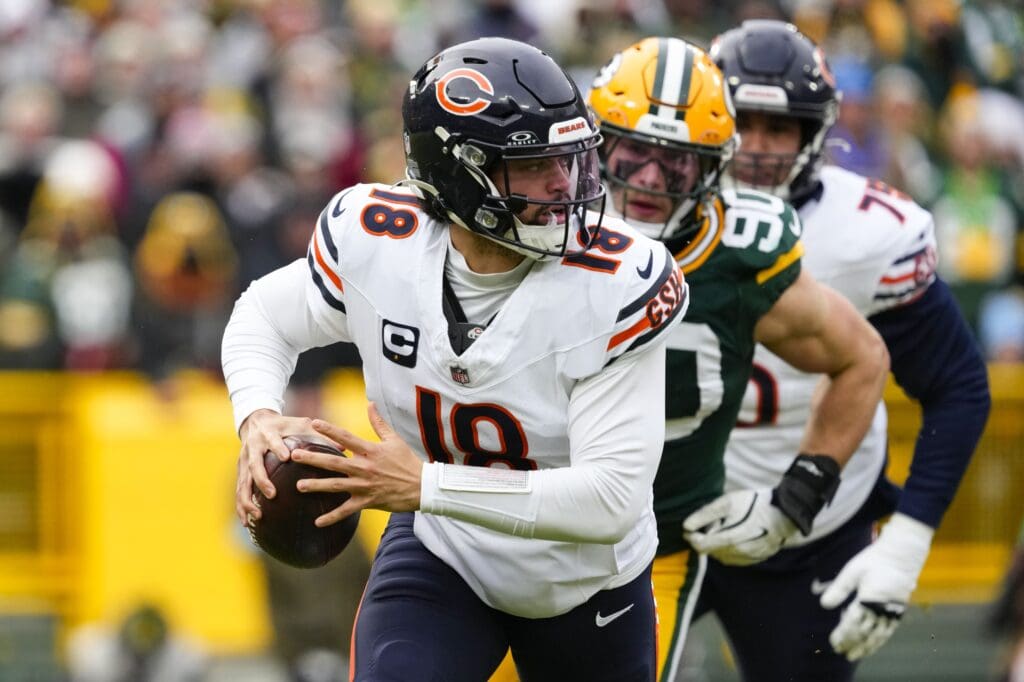 Jan 5, 2025; Green Bay, Wisconsin, USA; Chicago Bears quarterback Caleb Williams (18) during the game against the Chicago Bears at Lambeau Field. Mandatory Credit: Jeff Hanisch-Imagn Images