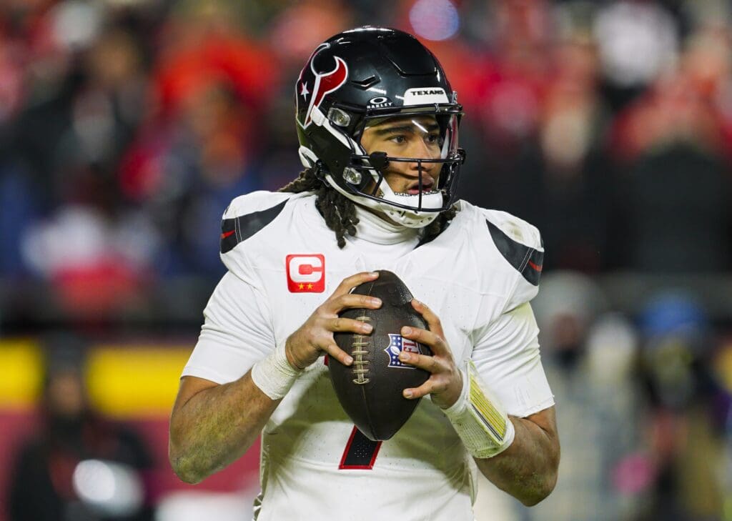 Jan 18, 2025; Kansas City, Missouri, USA; Houston Texans quarterback C.J. Stroud (7) drops back to pass during the second half against the Kansas City Chiefs in a 2025 AFC divisional round game at GEHA Field at Arrowhead Stadium. Mandatory Credit: Jay Biggerstaff-Imagn Images