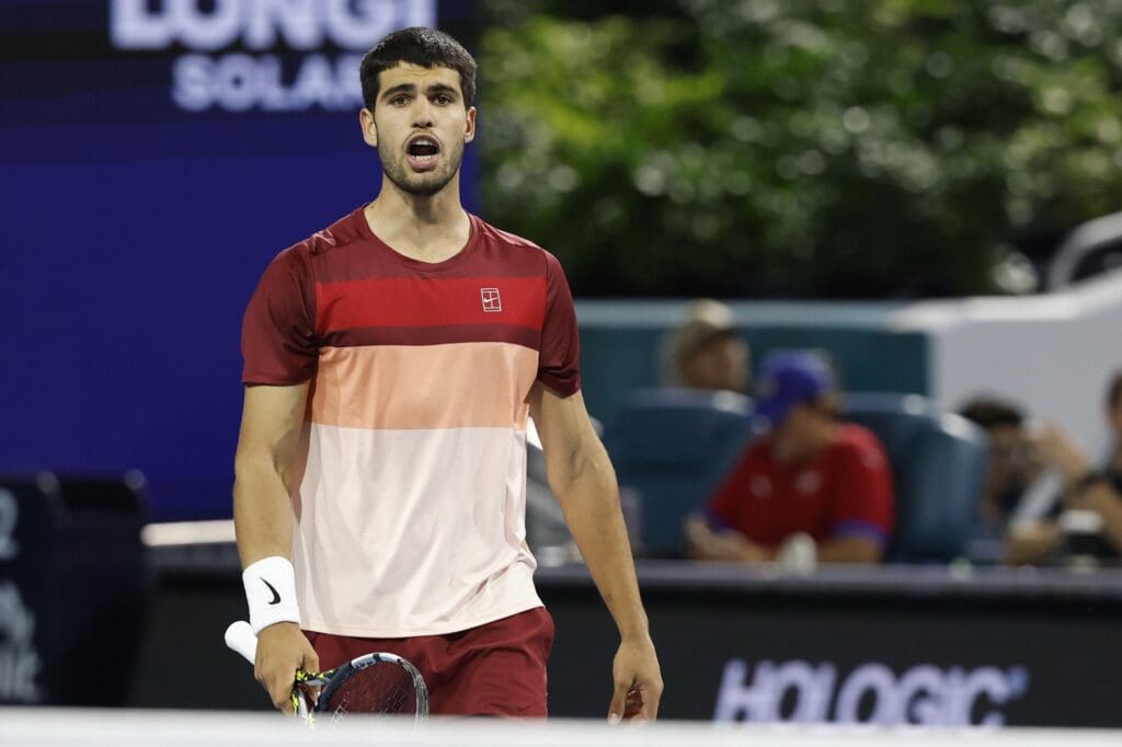 Mar 21, 2025; Miami, FL, USA; Carlos Alcaraz (ESP) talks to his box between points against David Goffin (BEL)(not pictured) on day four of the Miami Open at Hard Rock Stadium