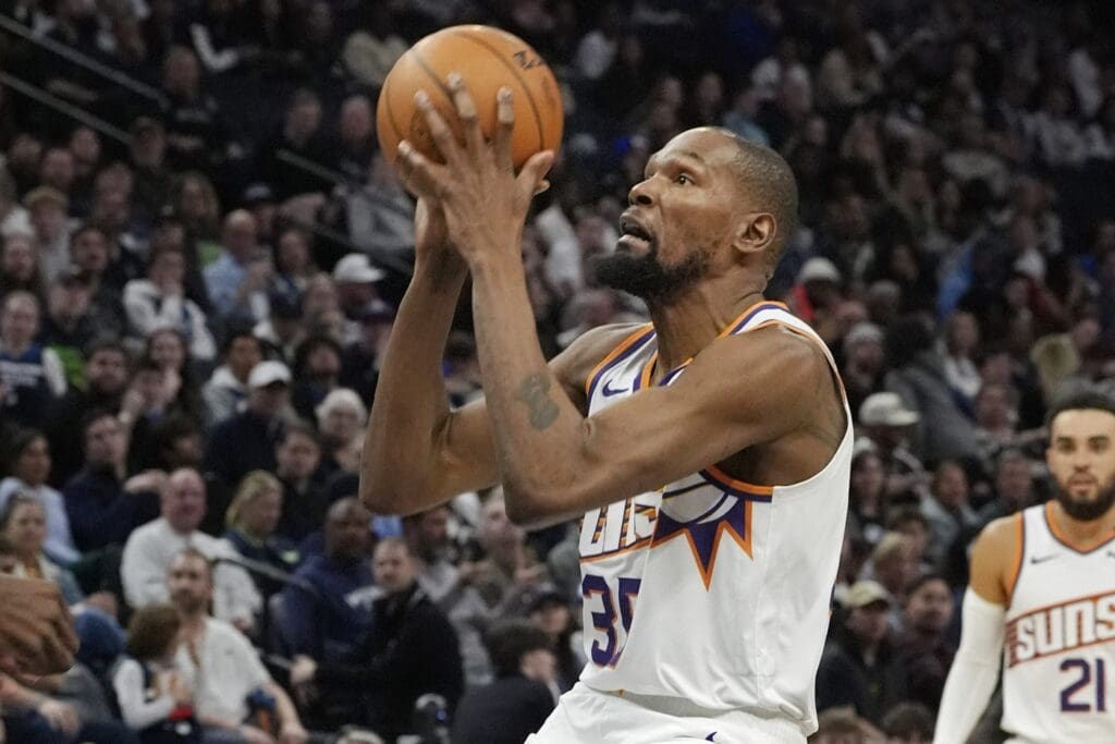 Mar 28, 2025; Minneapolis, Minnesota, USA; Phoenix Suns forward Kevin Durant (35) shoots against the Minnesota Timberwolves in the third quarter at Target Center