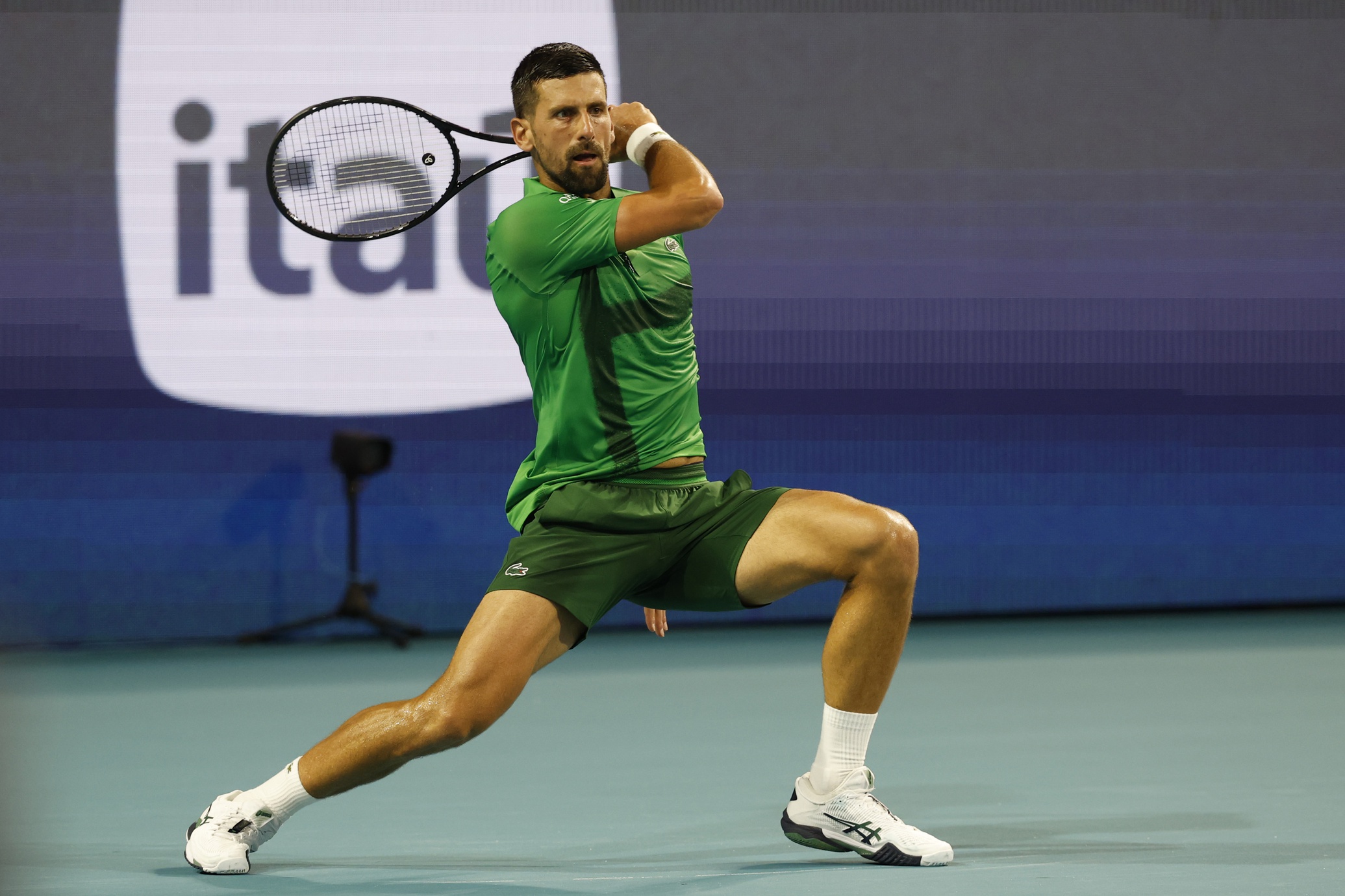 Mar 30, 2025; Miami, FL, USA; Novak Djokovic (SRB) hits a forehand against Jakub Mensik (CZE)(not pictured) in the men's singles championship of the Miami Open at Hard Rock Stadium. Mandatory Credit: Geoff Burke-Imagn Images