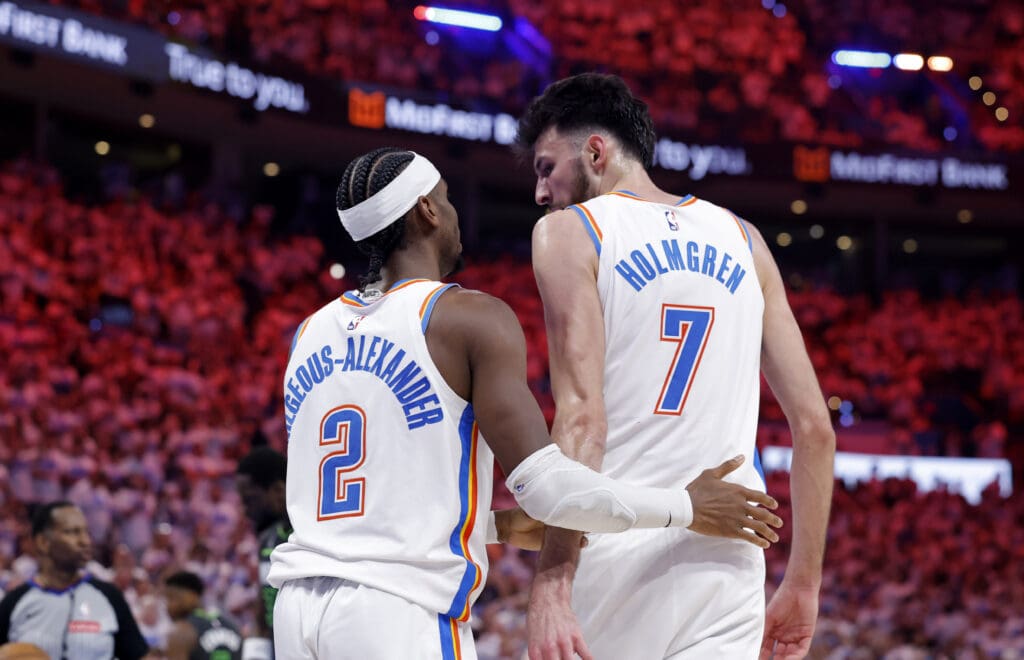 May 20, 2025; Oklahoma City, Oklahoma, USA; Oklahoma City Thunder guard Shai Gilgeous-Alexander (2) and forward Chet Holmgren (7) react after a play in the fourth quarter against the Minnesota Timberwolves during game one of the western conference finals for the 2025 NBA Playoffs at Paycom Center.
