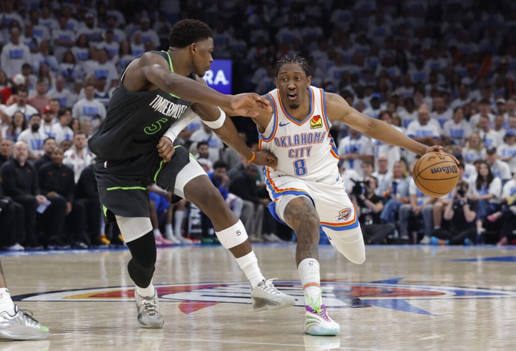 May 20, 2025; Oklahoma City, Oklahoma, USA; Oklahoma City Thunder forward Jalen Williams (8) drives against Minnesota Timberwolves guard Anthony Edwards (5) in the fourth quarter during game one of the western conference finals for the 2025 NBA Playoffs at Paycom Center.