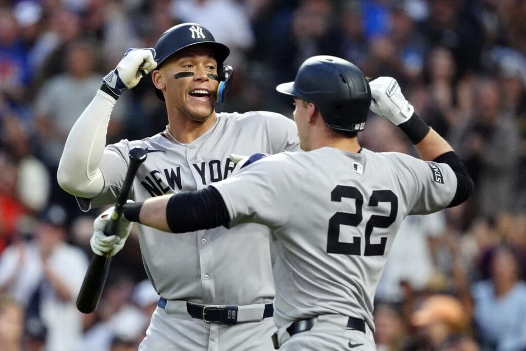 May 23, 2025; Denver, Colorado, USA; New York Yankees right fielder Aaron Judge (99) celebrates his solo home run with designated hitter Ben Rice (22) in the fifth inning against the Colorado Rockies at Coors Field.