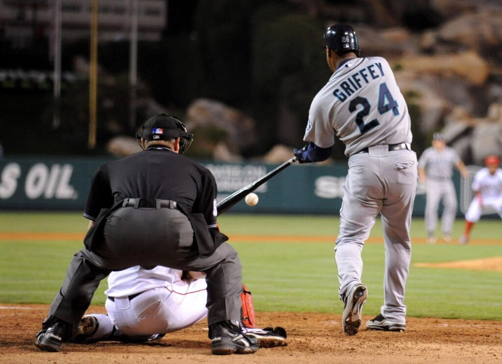 Sep 8, 2009; Anaheim, CA, USA; Seattle Mariners outfielder Ken Griffey Jr. (24) bats in the ninth inning as Los Angeles Angels catcher Mike Napoli (44) and home plate umpire Jim Joyce look on at Angel Stadium. The Angels defeated the Mariners 3-2 in 10 innings.
