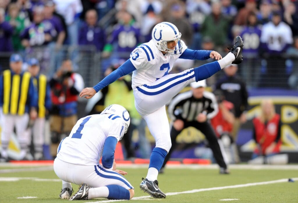 November 22, 2009; Baltimore, MD, USA; Indianapolis Colts PK Matt Stover (3) kicks a fourth quarter field goal out of the hold of punter Pat McAfee (1) against the Baltimore Ravens at M&T Bank Stadium. Indianapolis defeated Baltimore 17-15. Mandatory Credit: James Lang-USA TODAY Sports