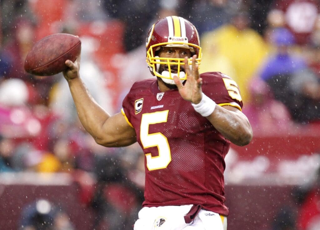 December 12, 2010; Landover, MD, USA; Washington Redskins quarterback Donovan McNabb (5) throws the ball against the Tampa Bay Buccaneers at FedEx Field