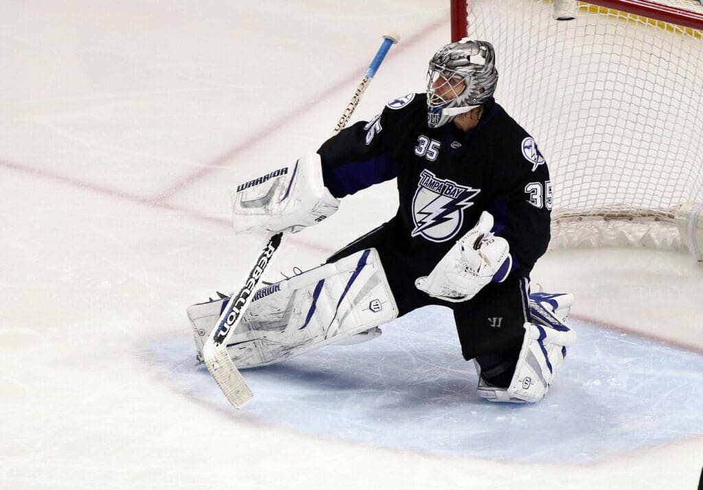 May 25, 2011; Tampa, FL, USA; Tampa Bay Lightning goalie Dwayne Roloson (35) defends the goal during the third period in game six of the eastern conference finals of the 2011 Stanley Cup playoffs against the Boston Bruins at St. Pete Times Forum. Tampa Bay Lightning defeated the Boston Bruins 5-4
