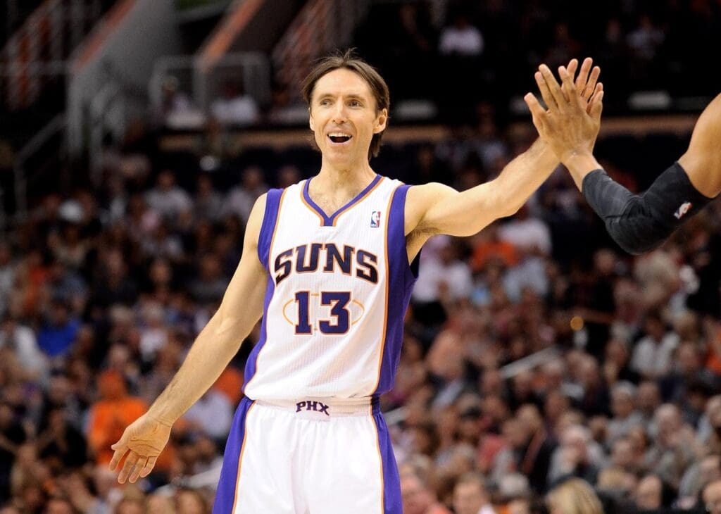 Mar. 14, 2012; Phoenix, AZ, USA; Phoenix Suns guard Steve Nash (13) is high fived while playing against the Utah Jazz during the first half at the US Airways Center.