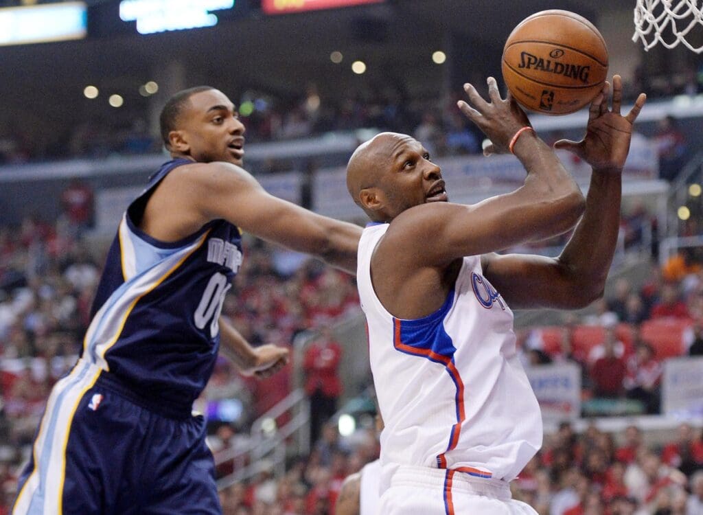 Apr 30, 2013; Los Angeles, CA, USA; Los Angeles Clippers Lamar Odom grabs a rebound in front of Memphis Grizzlies power forward Darrell Arthur (00) during 1st half action in game five of the first round of the 2013 NBA Playoffs at the Staples Center.