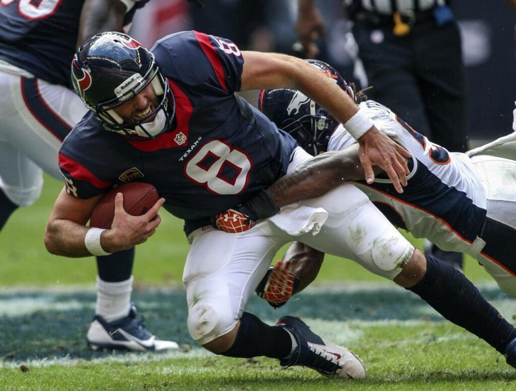 Dec 22, 2013; Houston, TX, USA; Houston Texans quarterback Matt Schaub (8) is sacked during the third quarter by Denver Broncos outside linebacker Danny Trevathan (59) at Reliant Stadium. The Broncos defeated the Texans 37-13