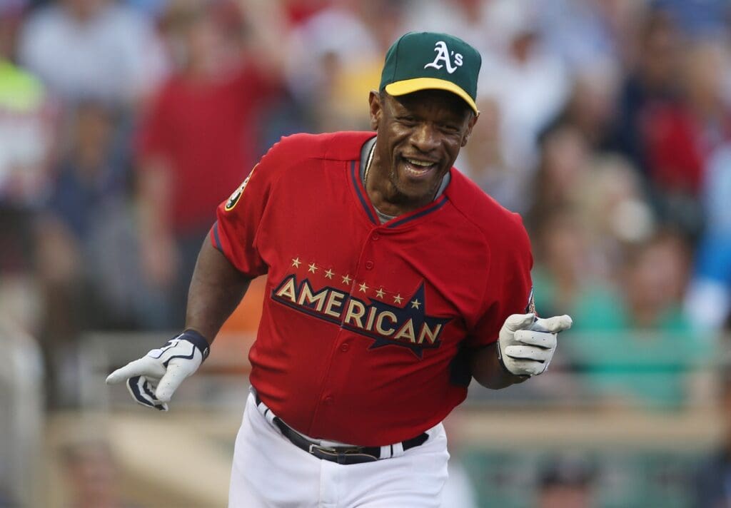 Jul 13, 2014; Minneapolis, MN, USA; Oakland Athletics former player Rickey Henderson reacts after hitting a home run during the MLB legends and celebrity softball game at Target Field