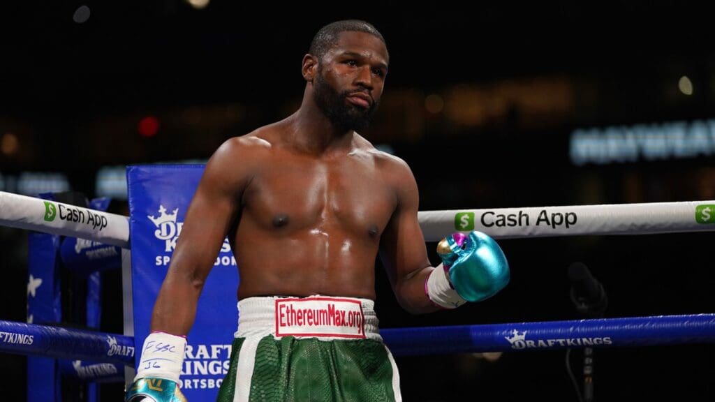 Jun 6, 2021; Miami, Florida, USA; Floyd Mayweather Jr. (Green Trunks) stands in the ring prior to his fight against Logan Paul (not pictured) at Hard Rock Stadium.