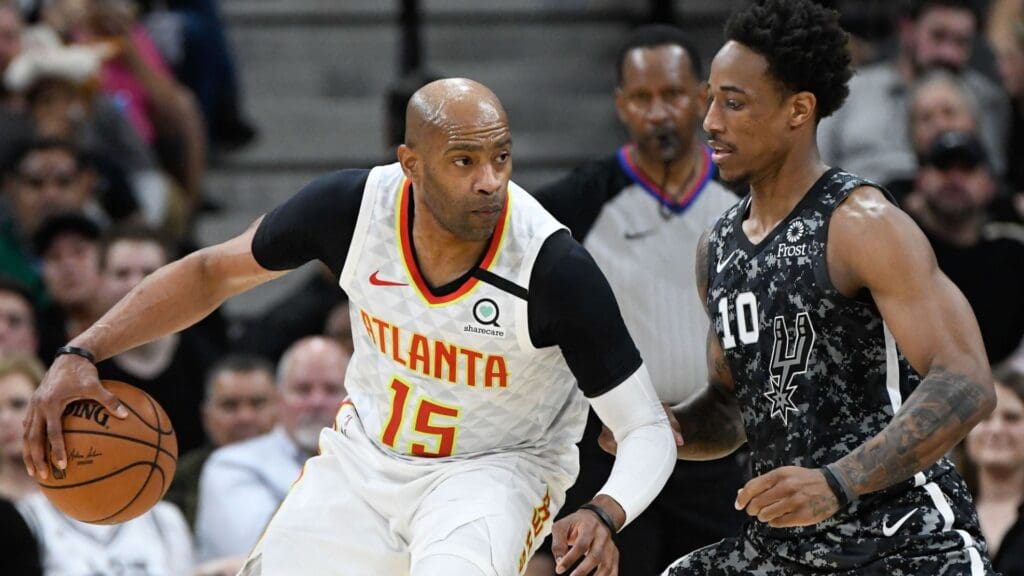 Jan 17, 2020; San Antonio, Texas, USA; Atlanta Hawks guard Vince Carter (15) looks to drive to the basket against San Antonio Spurs guard DeMar DeRozan (10) in the first half of the game at AT&T Center. Mandatory Credit: Scott Wachter-Imagn Images