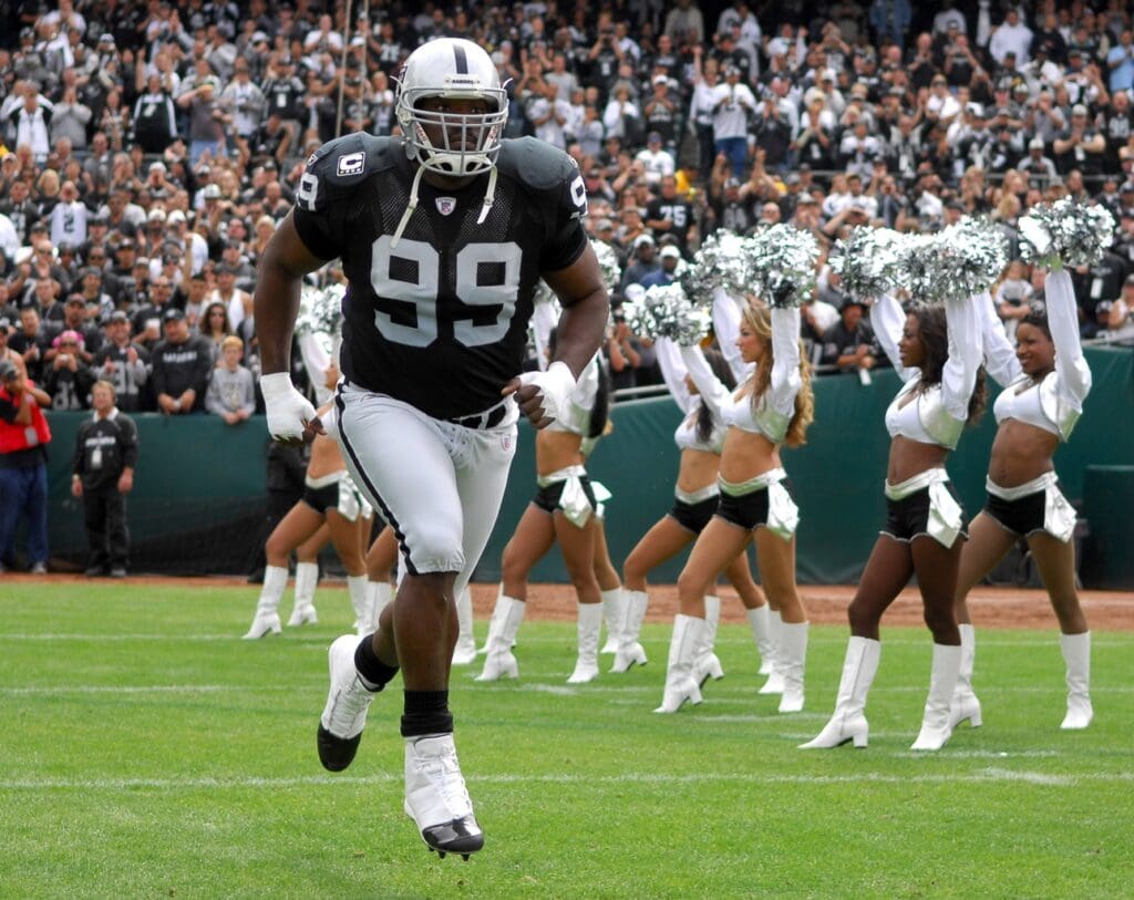 Sep 23, 2007; Oakland, CA, USA; Oakland Raiders defensive tackle Warren Sapp (99) runs onto field during player introductions before game against Cleveland Browns at McAfee Coliseum.
