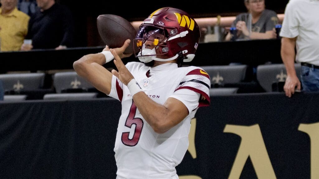 Washington Commanders quarterback Jayden Daniels (5) warms up before a game against the New Orleans Saints at Caesars Superdome.