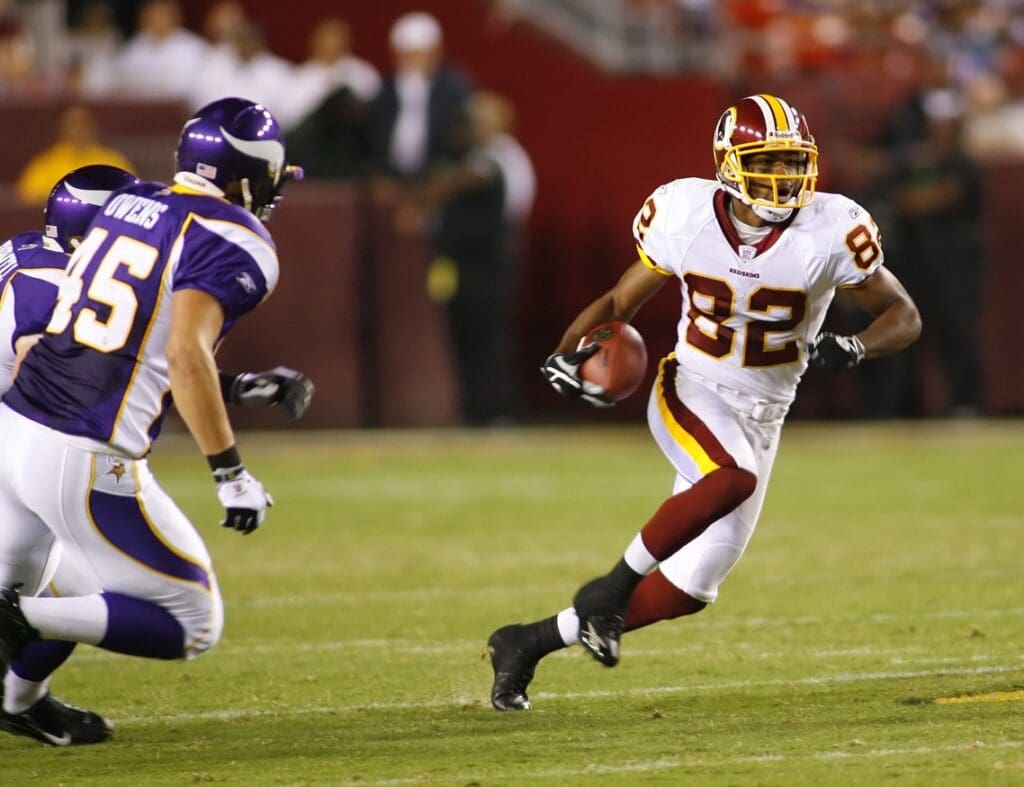 Sept. 11, 2006; Landover, MD, USA; Washington Redskins wide receiver (82) Antwaan Randle El avoids Minnesota Vikings defender (45) Richard Owens during a punt return at FedEx Field.