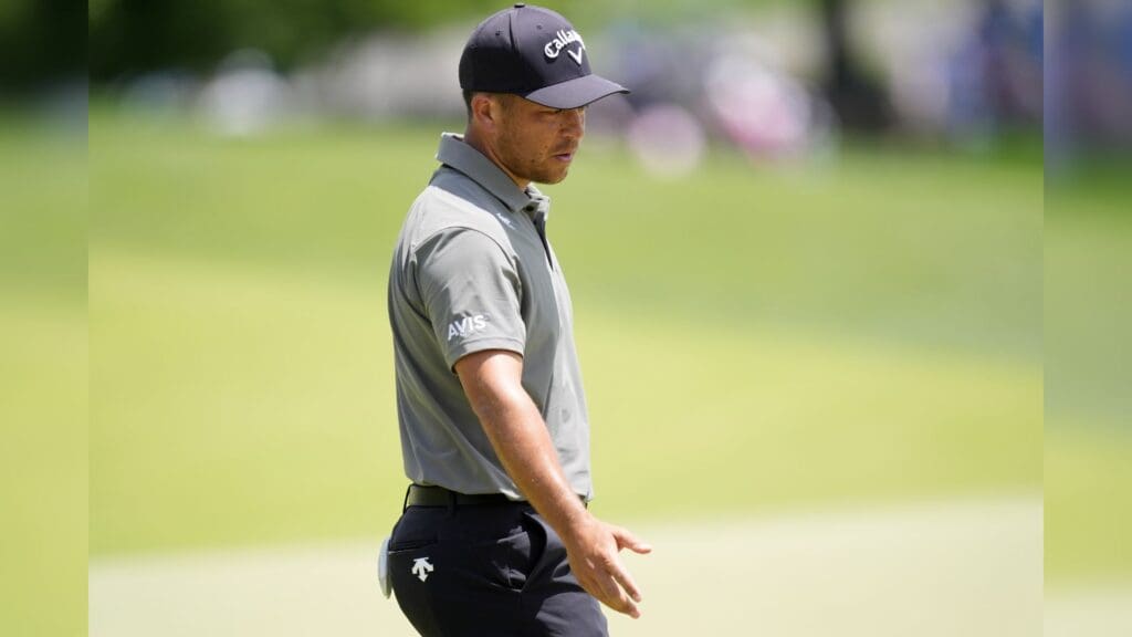 May 18, 2025; Charlotte, North Carolina, USA; Xander Schauffele reacts after missing a putt 15th green during the final round of the PGA Championship golf tournament at Quail Hollow.
