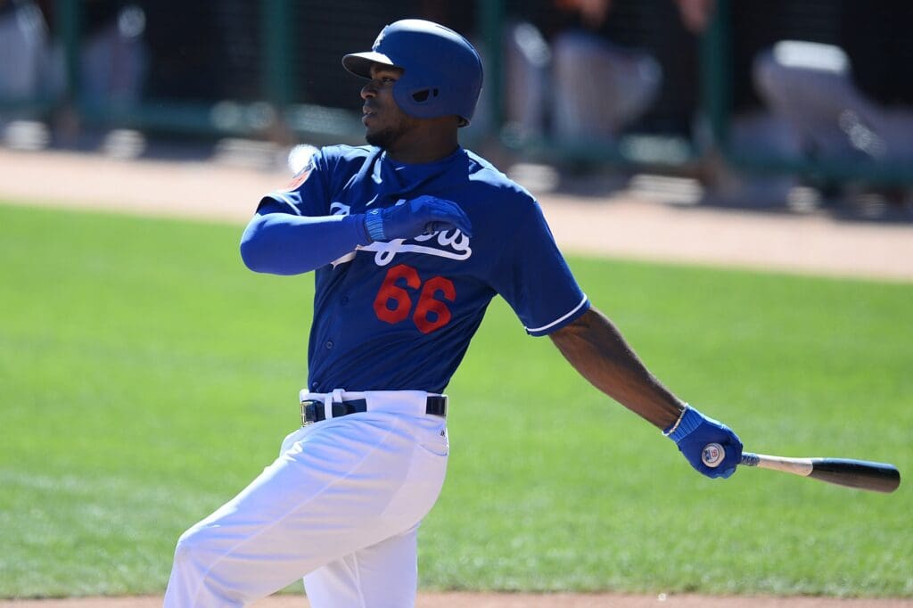 Mar 7, 2017; Phoenix, AZ, USA; Los Angeles Dodgers right fielder Yasiel Puig (66) bats against the San Francisco Giants during the fourth inning at Camelback Ranch.
