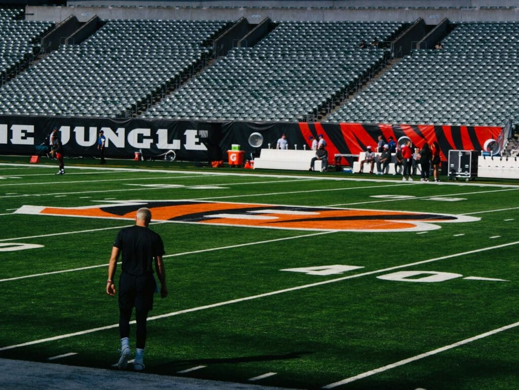 A man standing on top of a football field