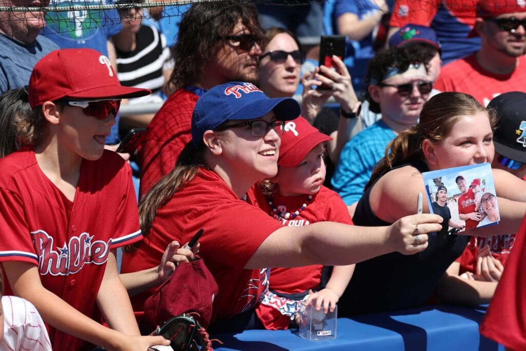 Feb 26, 2025; Dunedin, Florida, USA; fans wait for autographs before a spring training game between the Philadelphia Phillies and Toronto Blue Jays at TD Ballpark.