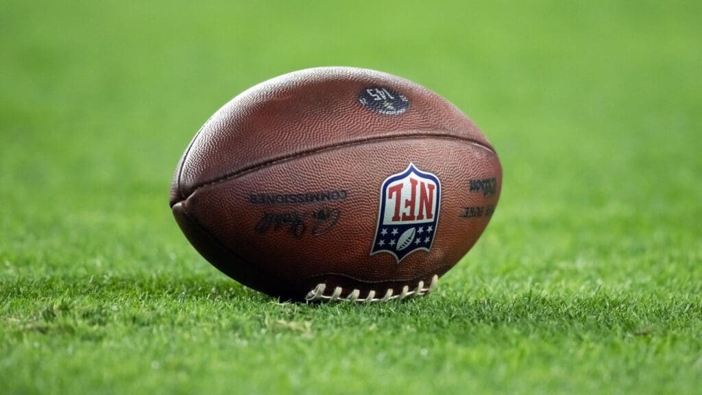 Detailed view of an official Wilson NFL football on the field during the Minnesota Vikings game against the Los Angeles Rams during an NFC wild card game at State Farm Stadium.