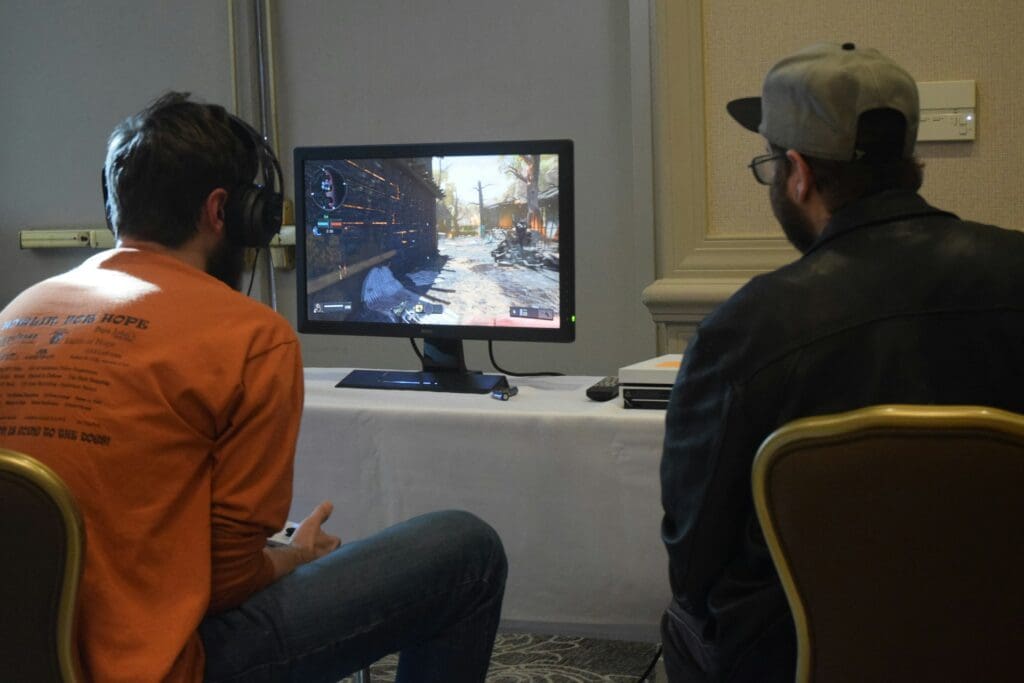two men playing a videogame