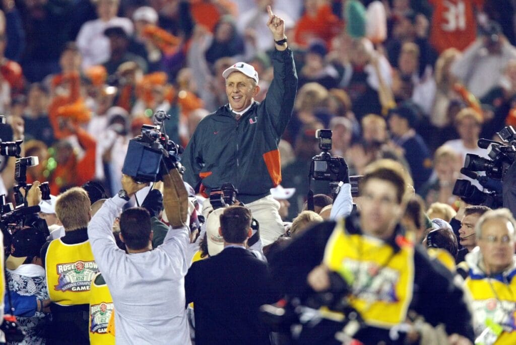 (01/03/2002) Miami head coach Larry Coker rides on his players shoulders and holds up his finger after the Hurricanes defeated Nebraska in the Bowl Championship Series in the Rose Bowl, January 3, in Pasadena, CA.