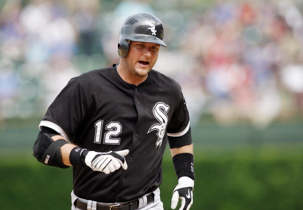 June 11, 2010; Chicago, IL, USA; Chicago White Sox catcher A.J. Pierzynski (12) rounds the bases after hitting a solo home run during the seventh inning against the Chicago Cubs at Wrigley Field.