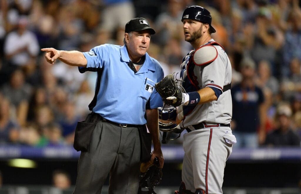 Jul 21, 2016; Denver, CO, USA; Atlanta Braves catcher A.J. Pierzynski (15) reacts to a base running interference call by umpire Mike Winters (33) allowing Colorado Rockies first baseman Daniel Descalso (3) (not pictured) to score in the eighth inning at Coors Field. The Rockies defeated the Braves 7-3.