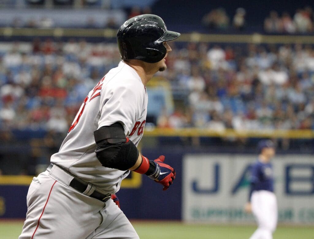May 24, 2014; St. Petersburg, FL, USA; Boston Red Sox designator hitter A.J. Pierzynski watches the flight of his three-run home run during the first inning against the Tampa Bay Rays at Tropicana Field.