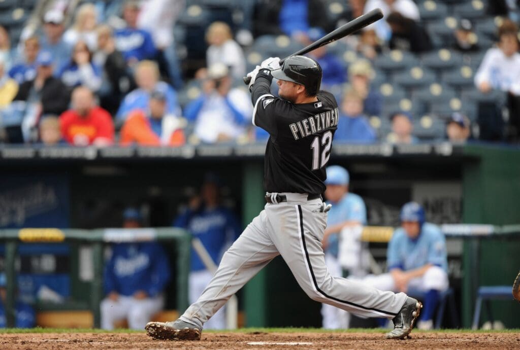 Sep 18, 2011; Kansas City, MO, USA; Chicago White Sox catcher A.J. Pierzynski (12) hits a three-run home run against the Kansas City Royals during the eighth inning at Kauffman Stadium.
