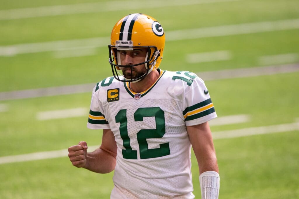 Sep 13, 2020; Minneapolis, Minnesota, USA; Green Bay Packers quarterback Aaron Rodgers (12) celebrates a touchdown in the fourth quarter against the Minnesota Vikings at U.S. Bank Stadium.